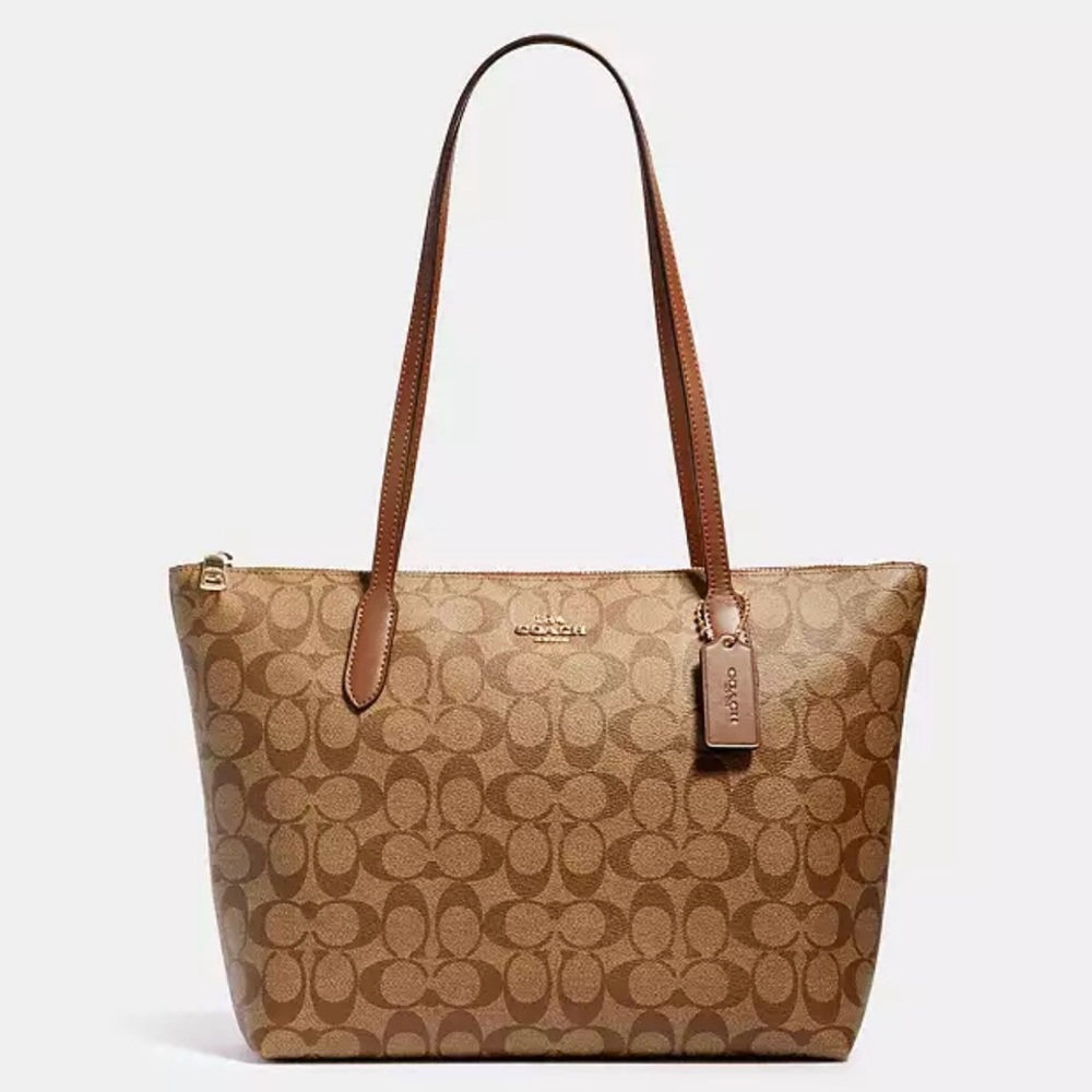Tote Coach bag rich brown with tan color. Very roomy has pockets for cell phone.